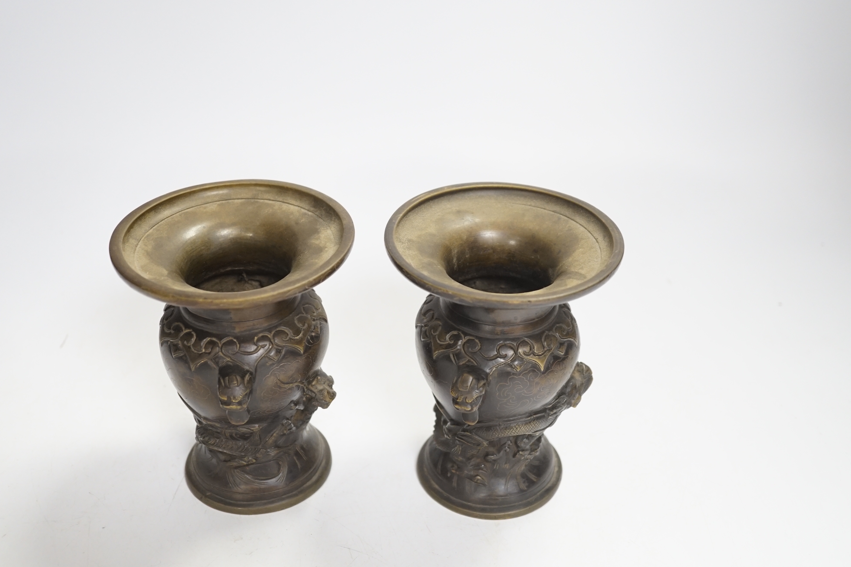 A pair of small Japanese bronze 'dragon' vases, 12.5cm